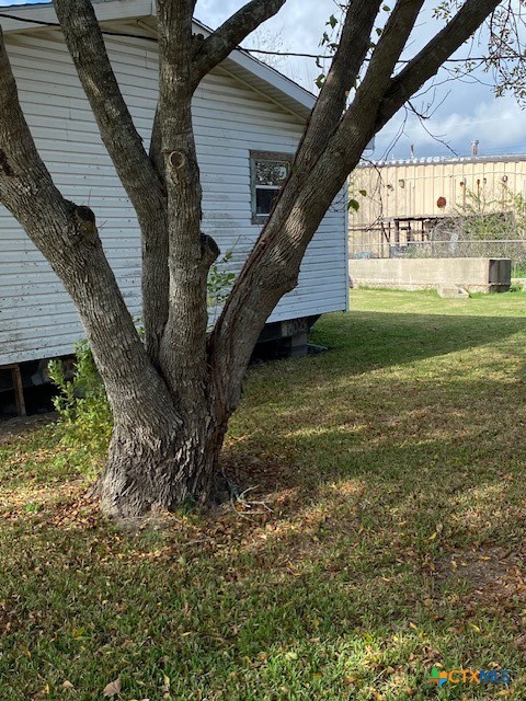 76 College Placedo, TX 77977 - Photo 17 of 17 a backyard of a house with lots of green space