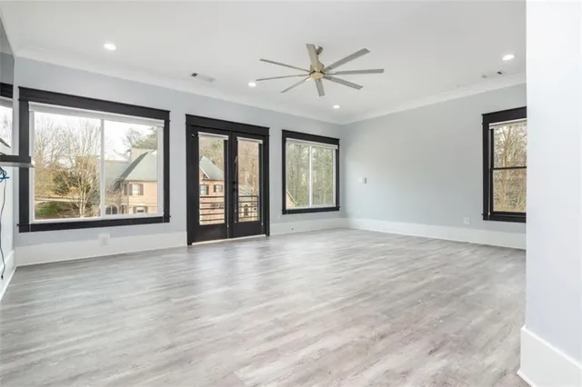 wooden floor in an empty room with a window