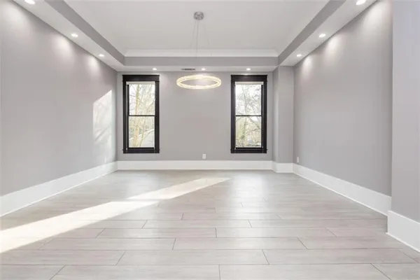a view of kitchen with a sink a fireplace and window