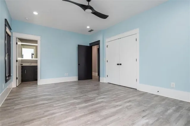 a kitchen with counter top space a sink stainless steel appliances and cabinets