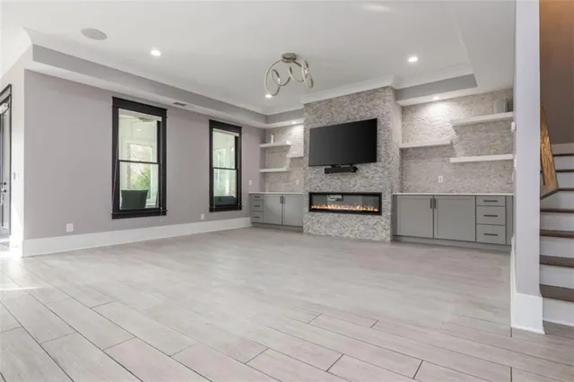 a large kitchen with kitchen island a sink stainless steel appliances and cabinets