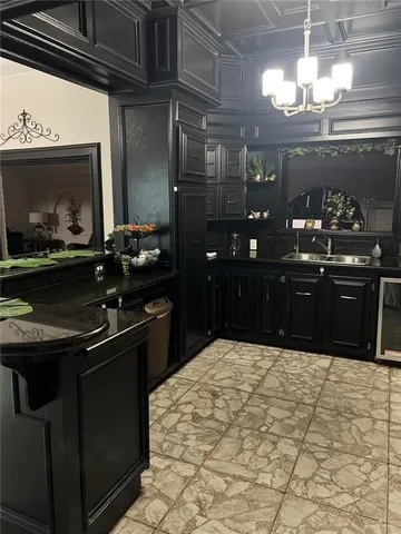 a kitchen with a sink and cabinets