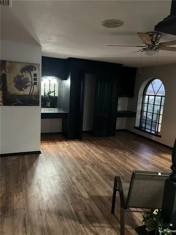 a view of a livingroom with furniture and staircase