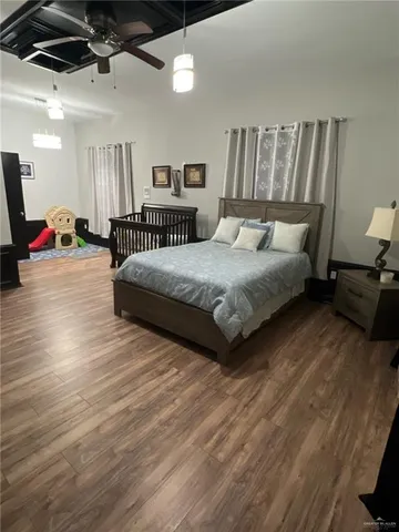 a bedroom with bed and window