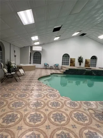 a view of a livingroom with kitchen furniture and window