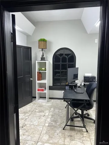 a workspace with furniture and a window