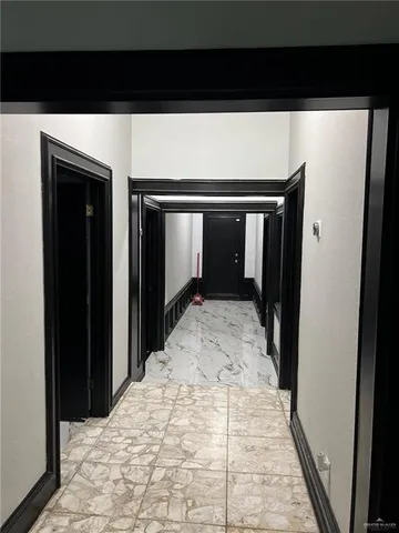 a bedroom with a bed and a mirror