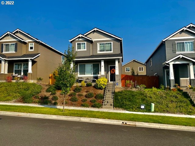 2018 South Taverner Drive Ridgefield, WA 98642 - Photo 1 of 32 a front view of a house with a yard