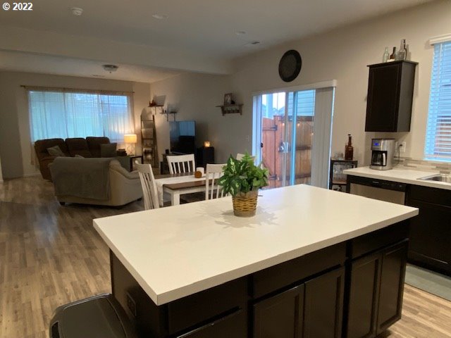 2018 South Taverner Drive Ridgefield, WA 98642 - Photo 11 of 32 a kitchen with a table chairs and a large window