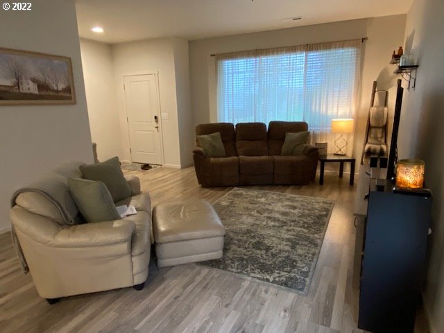 2018 South Taverner Drive Ridgefield, WA 98642 - Photo 13 of 32 a living room with furniture and a flat screen tv