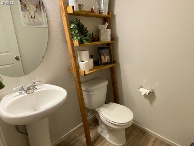 2018 South Taverner Drive Ridgefield, WA 98642 - Photo 14 of 32 a white toilet sitting next to a bathroom sink