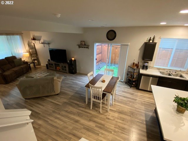 2018 South Taverner Drive Ridgefield, WA 98642 - Photo 16 of 32 a living room with furniture a flat screen tv and a fireplace