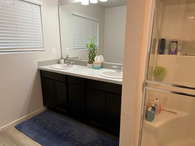 2018 South Taverner Drive Ridgefield, WA 98642 - Photo 20 of 32 a bathroom with a sink and a mirror