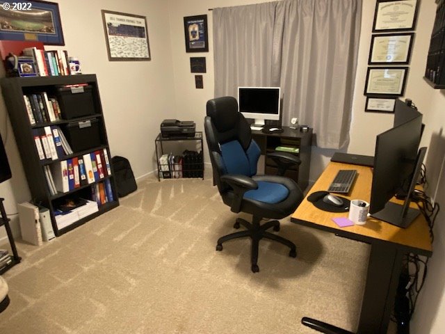 2018 South Taverner Drive Ridgefield, WA 98642 - Photo 21 of 32 a view of a workspace with furniture and a window