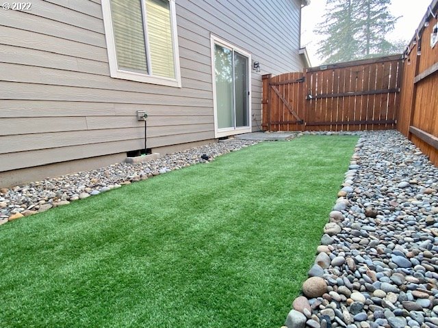 2018 South Taverner Drive Ridgefield, WA 98642 - Photo 27 of 32 a view of a backyard with wooden fence