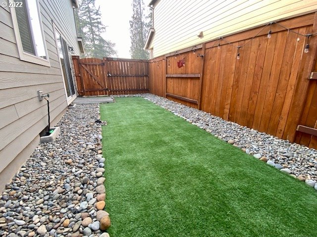 2018 South Taverner Drive Ridgefield, WA 98642 - Photo 28 of 32 a view of a backyard with wooden fence