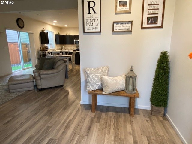 2018 South Taverner Drive Ridgefield, WA 98642 - Photo 4 of 32 a living room with furniture and a wooden floor