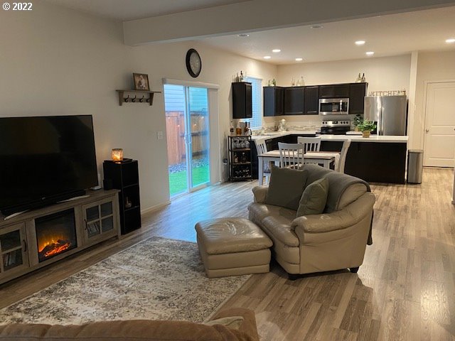 2018 South Taverner Drive Ridgefield, WA 98642 - Photo 6 of 32 a living room with furniture and a flat screen tv