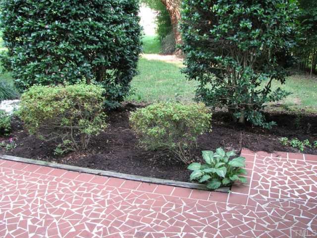 5915 Farm Gate Road Raleigh, NC 27606 - Photo 5 of 11 a view of a garden with a bench