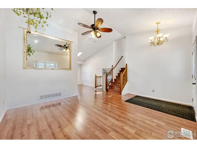 a view interior of a house wooden floor and an entryway