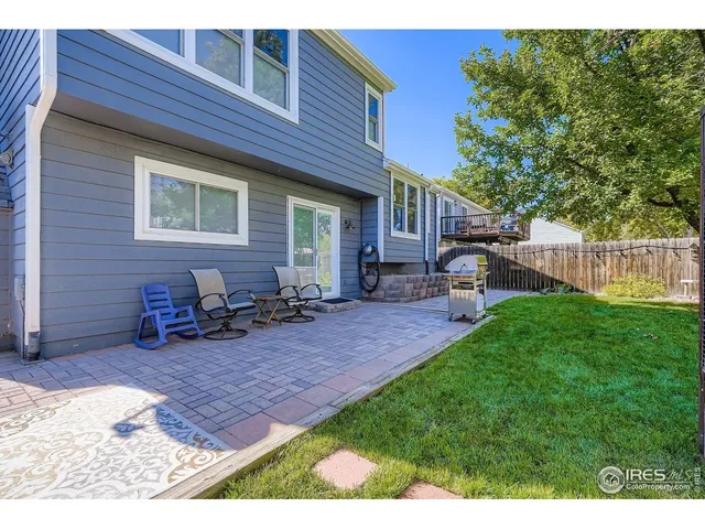 a view of a house with backyard porch and sitting area
