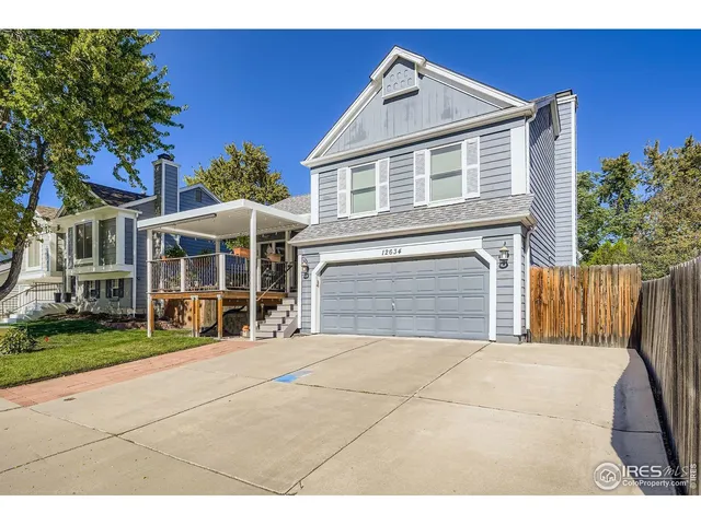a view of house with yard and hallway