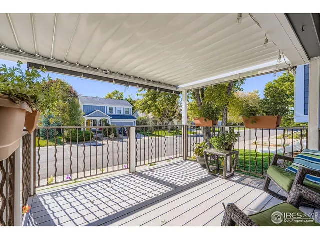 a view of a wooden chairs in a patio