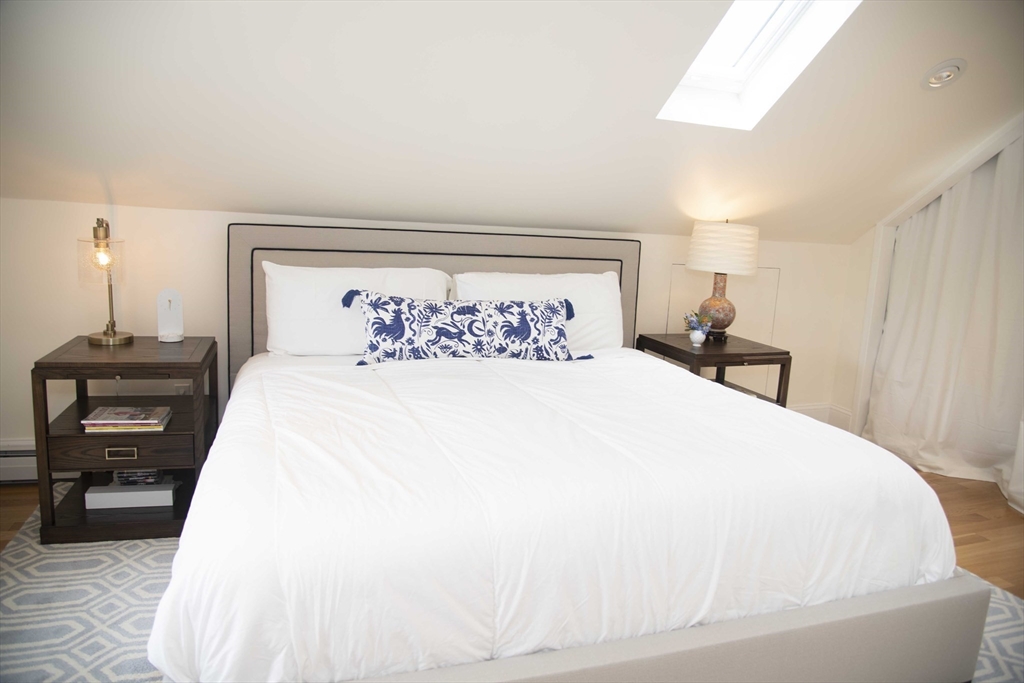 3 Chester Road, Unit 3 Belmont, MA 02478 - Photo 16 of 40 a bedroom with a bed and a tv