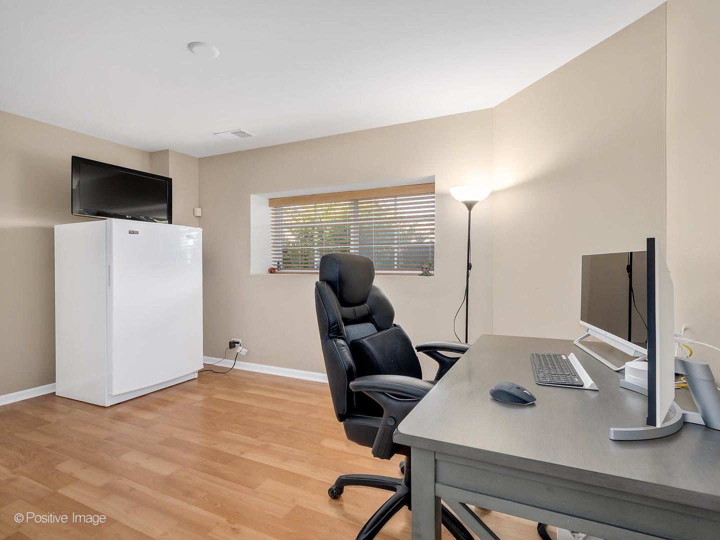 6567 Church Street Hanover Park, IL 60133 - Photo 16 of 19 a room with furniture and a flat screen tv