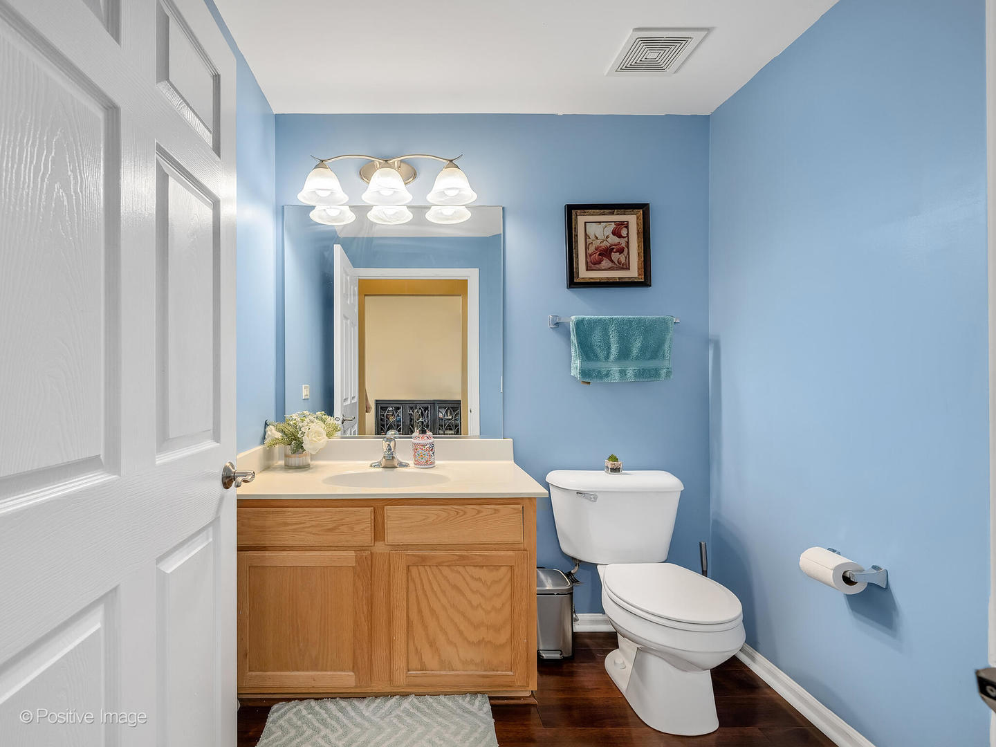 6567 Church Street Hanover Park, IL 60133 - Photo 9 of 19 a bathroom with a toilet sink and mirror