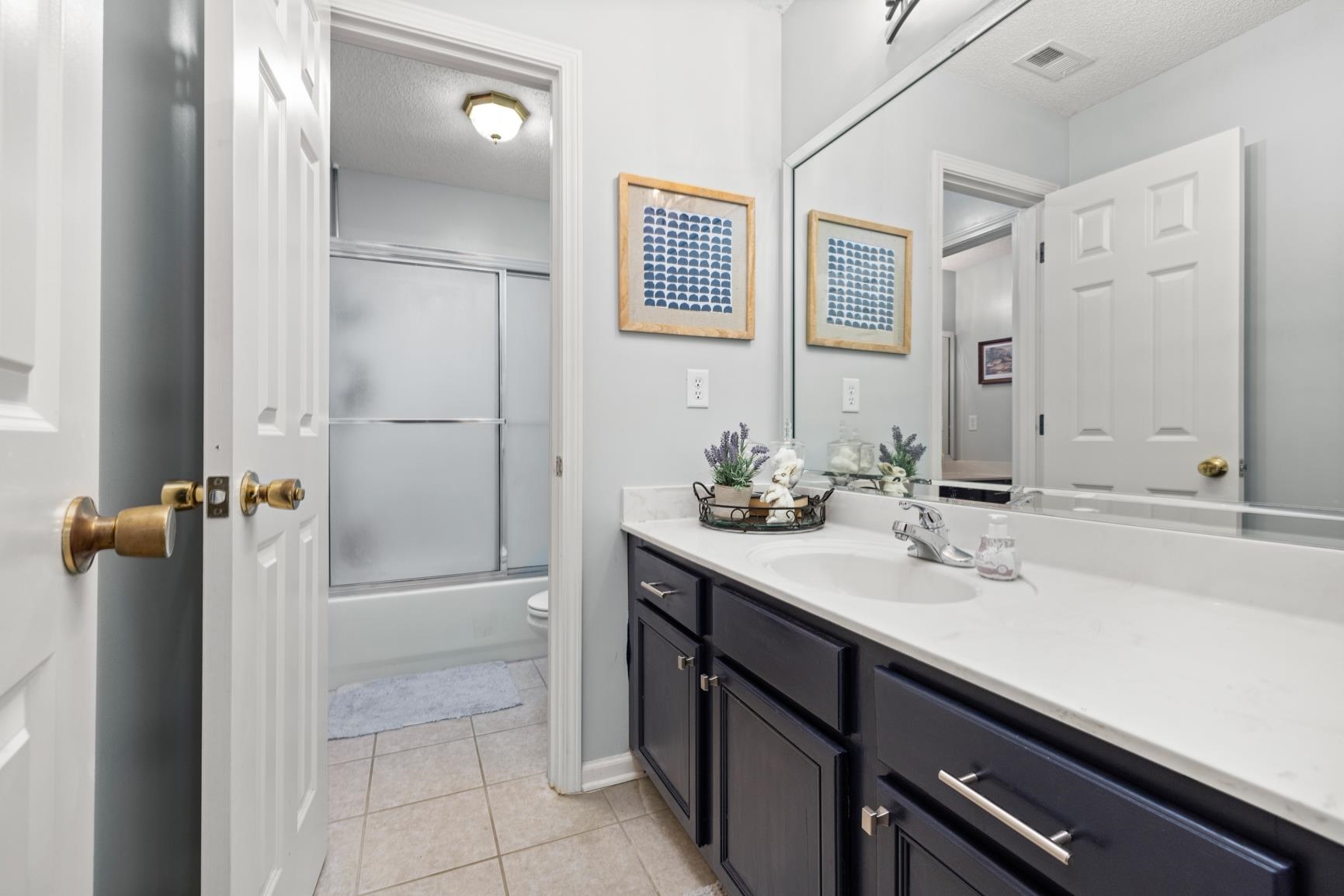 4760 Conner Whitefield Road Ripley, TN 38063 - Photo 23 of 40 a bathroom with a sink double vanity and a mirror