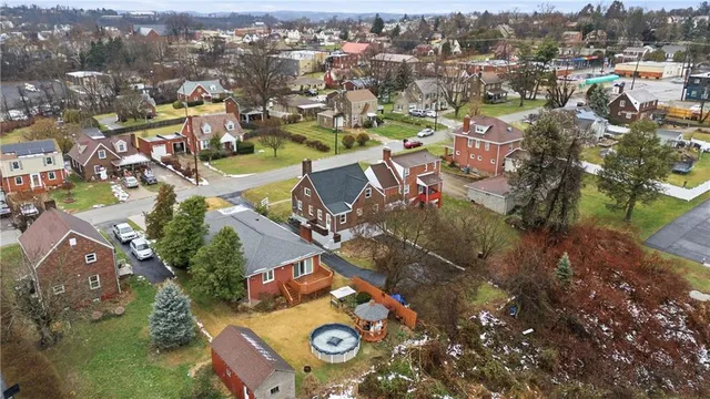 an aerial view of a house with a lake view