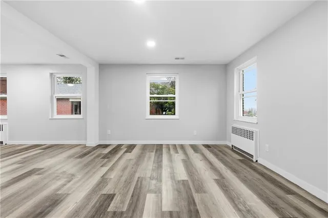 a view of empty room with windows