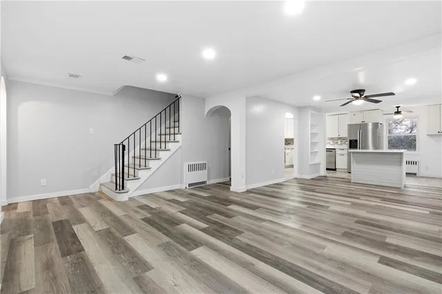 a view of a kitchen with a sink and cabinets