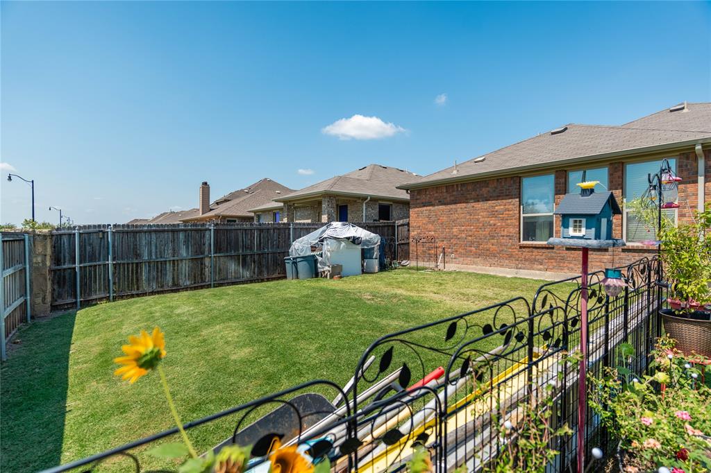 1219 Mount Olive Lane Forney, TX 75126 - Photo 12 of 12 a view of a swimming pool with a patio