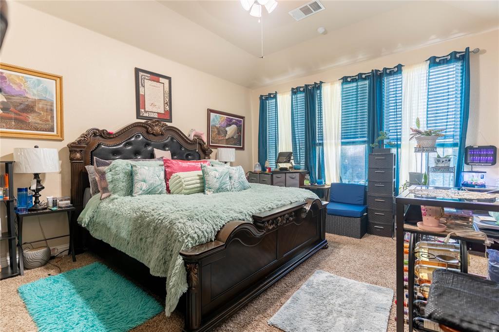 1219 Mount Olive Lane Forney, TX 75126 - Photo 4 of 12 a bedroom with bed and large windows