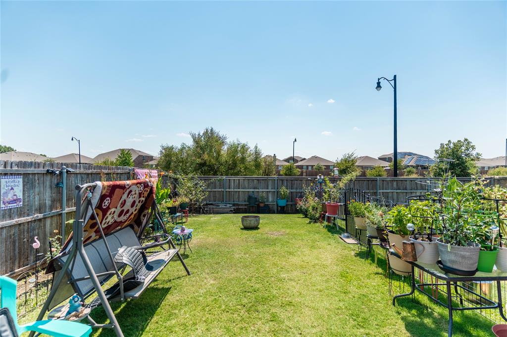 1219 Mount Olive Lane Forney, TX 75126 - Photo 10 of 12 a view of a swimming pool with outdoor seating and plants
