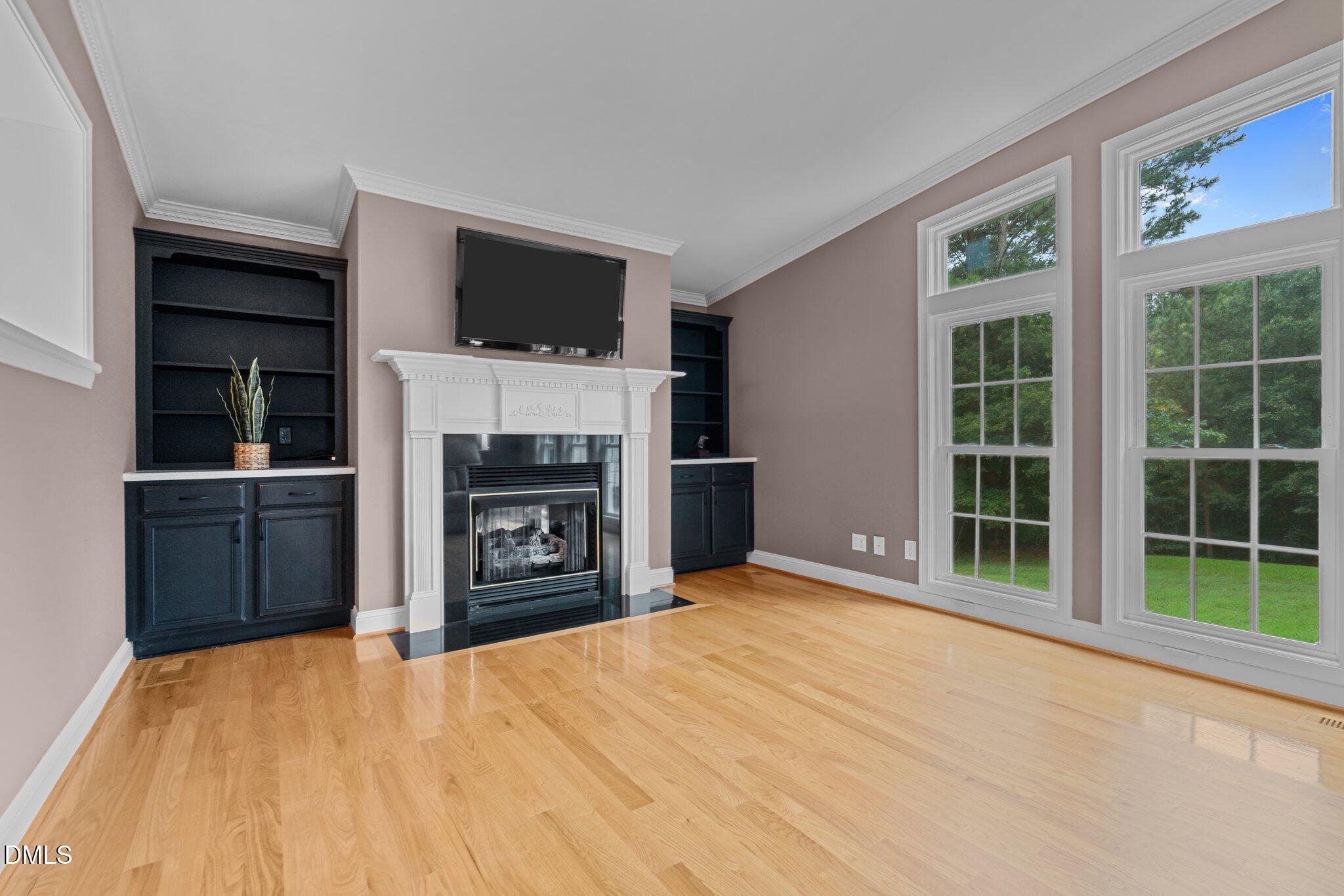 431 Patterson Ridge Lane Sanford, NC 27330 - Photo 13 of 29 a view of a livingroom with a kitchen and a fireplace