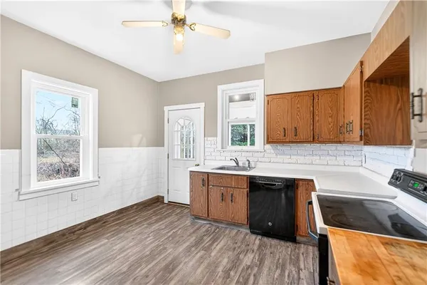 a kitchen with a sink cabinets and window