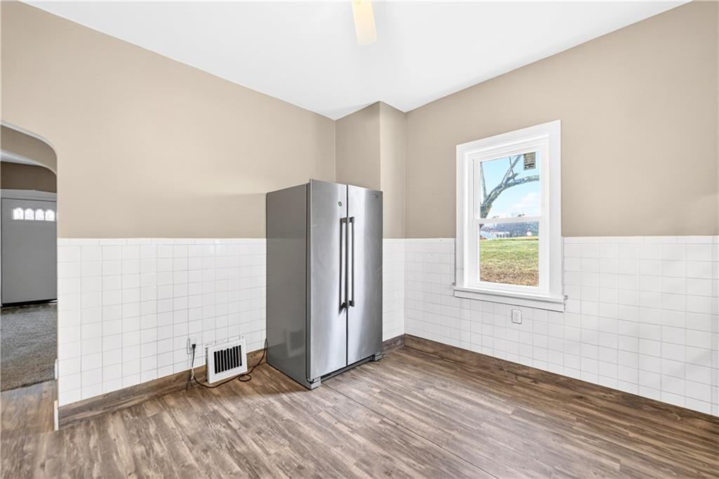 1107 Reeves Avenue Monessen, PA 15062 - Photo 16 of 33 a view of a livingroom with wooden floor and a window