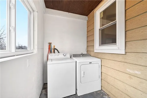 a utility room with dryer and washer