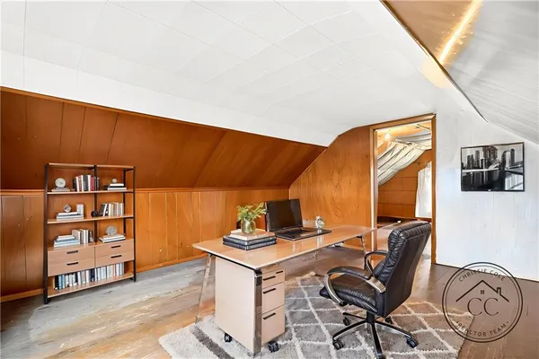 a view of workspace with wooden floor