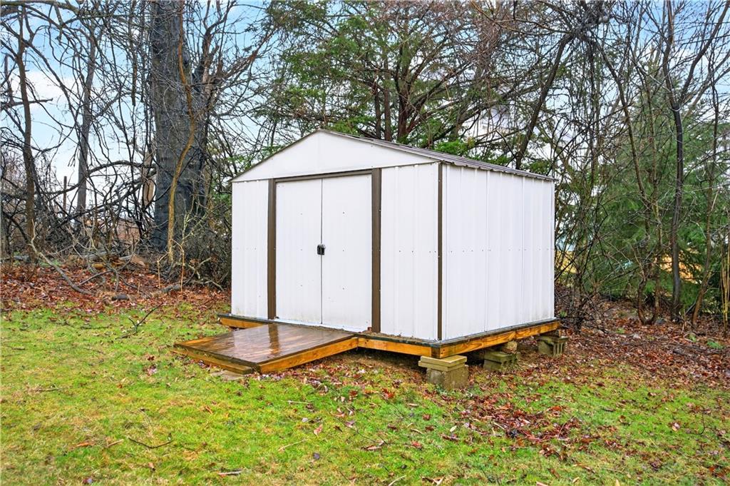 1107 Reeves Avenue Monessen, PA 15062 - Photo 4 of 33 a backyard of a house with a yard and seating space