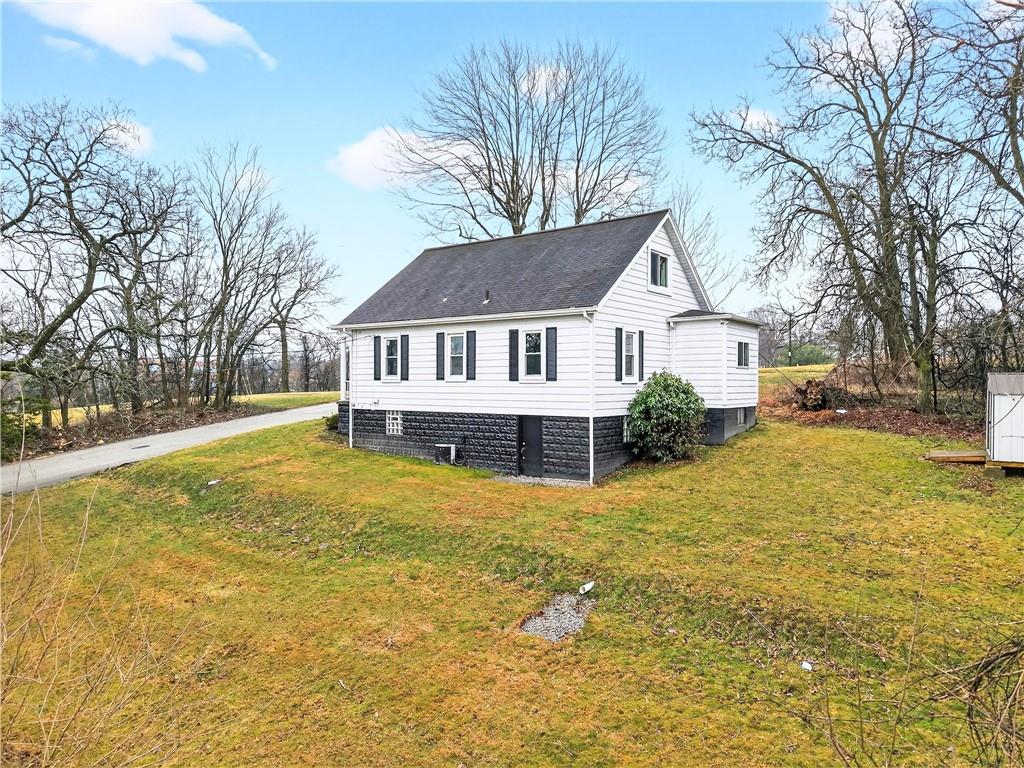 1107 Reeves Avenue Monessen, PA 15062 - Photo 6 of 33 a front view of a house with a yard