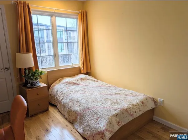 a bathroom with a granite countertop toilet a sink and a bathtub