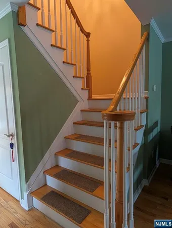a kitchen with granite countertop a stove a sink and a microwave