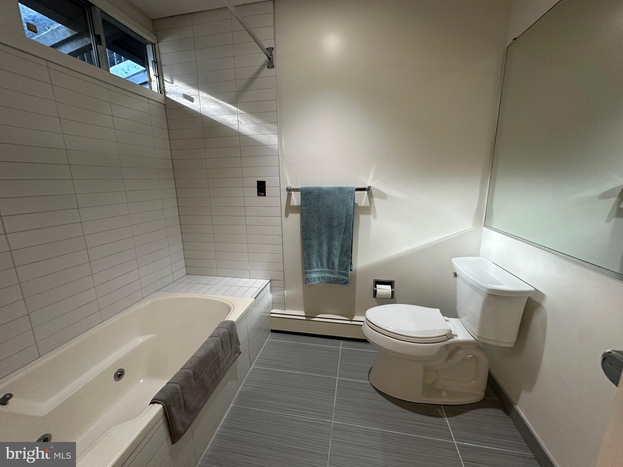 6016 Terrace Road Baltimore, MD 21209 - Photo 25 of 52 a bathroom with a toilet and a bathtub