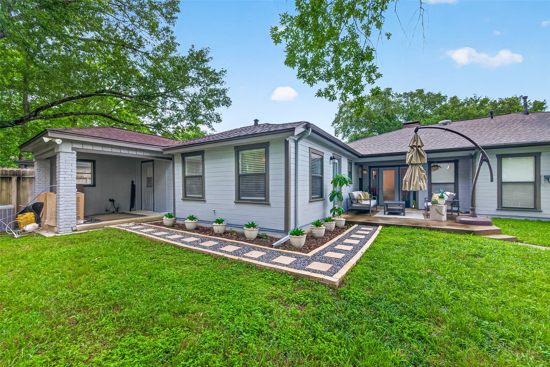 548 Brandon Road Conroe, TX 77302 - Photo 32 of 37 Fully fenced backyard with covered patio