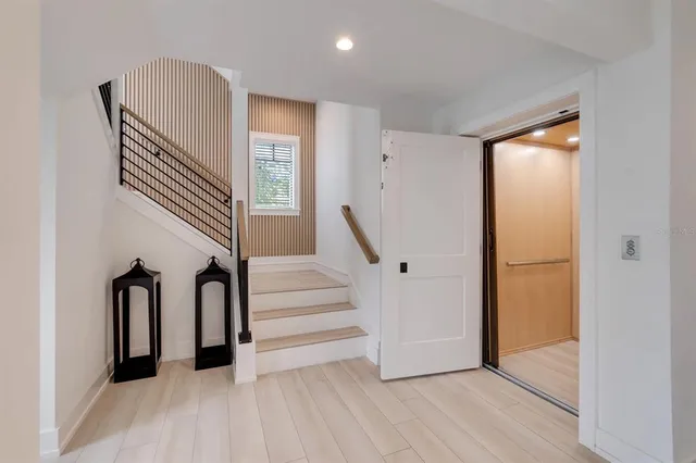 a kitchen with stainless steel appliances granite countertop a sink and a refrigerator