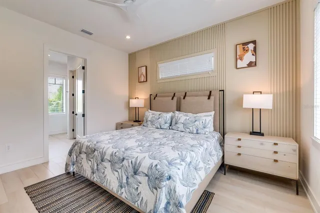 a bathroom with a shower sink and mirror